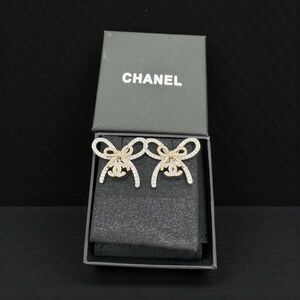 CHANEL Elegant Gold Bow Earrings